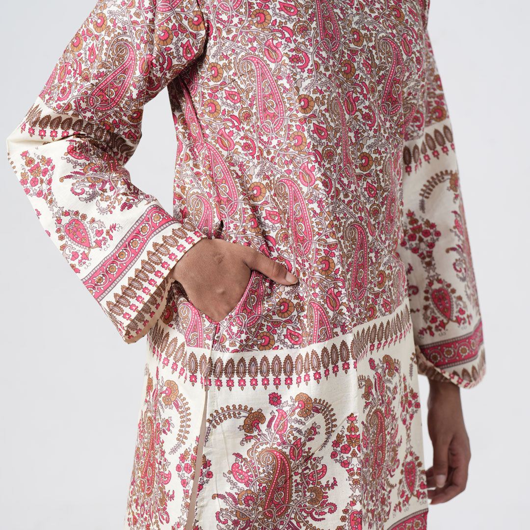 Ruhaani knee length kurti with convenient side pockets and a pink paisley print