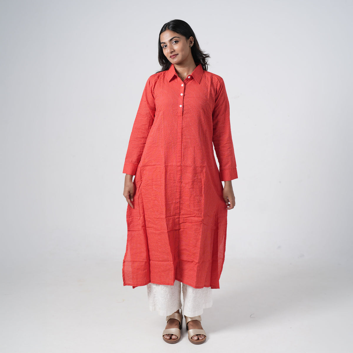 Coral Red Long Shirt for women featuring subtle vertical patterns, a classic shirt collar and a button-down front