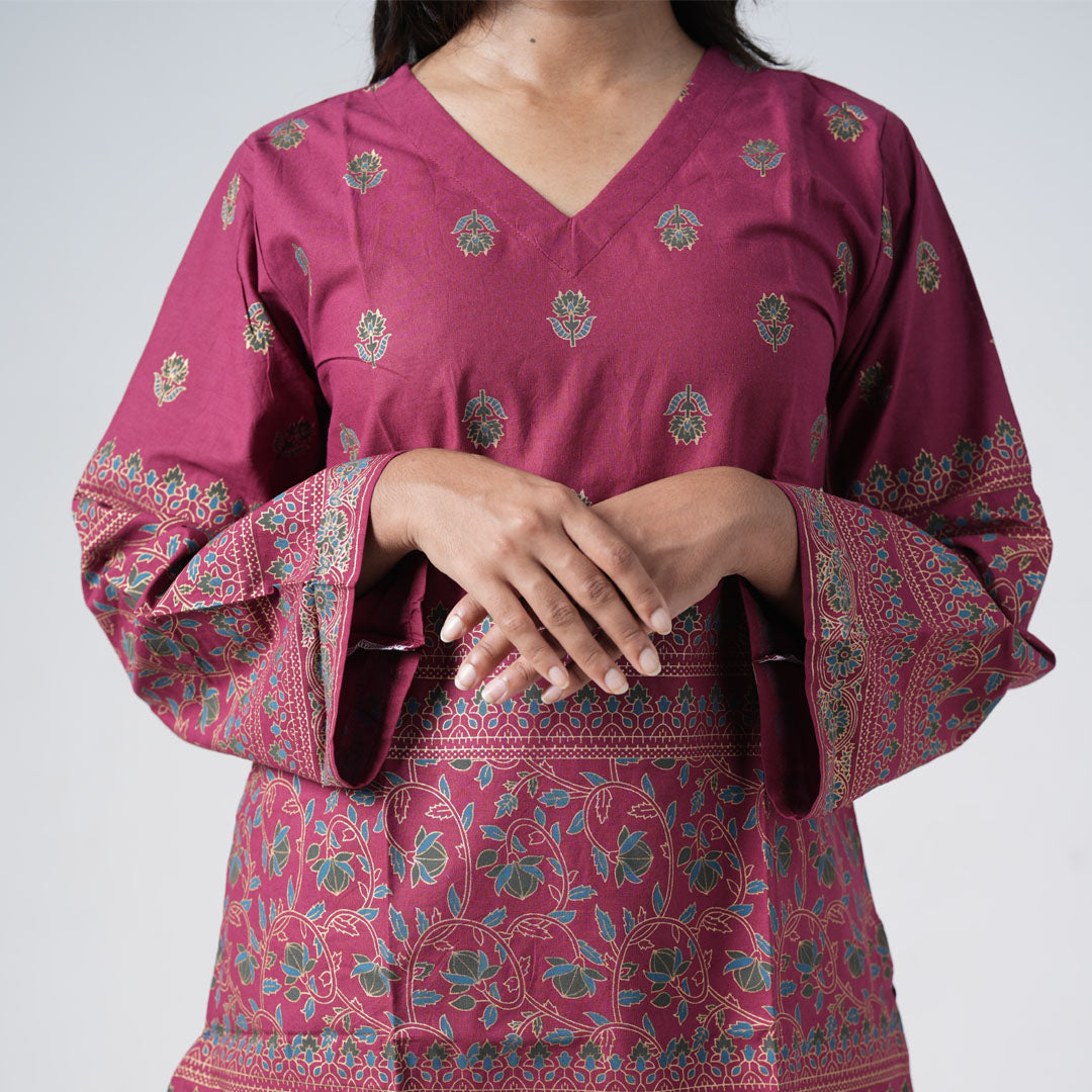 Ruby Short Kurti with a V neckline and small floral motifs on ruby pink fabric