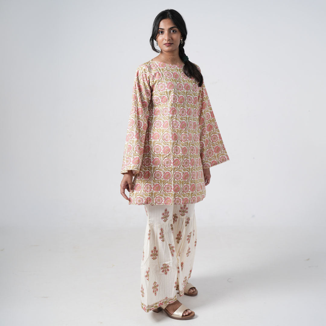 Aafreen Peach Blush co-ord set for women featuring a peach floral printed top with matching wide-leg pants on an ivory base