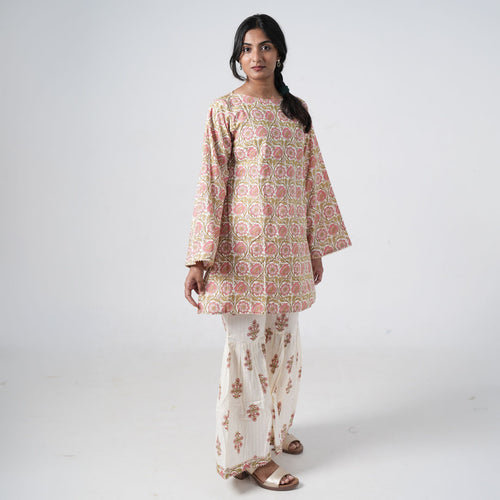 Aafreen Peach Blush co-ord set for women featuring a peach floral printed top with matching wide-leg pants on an ivory base