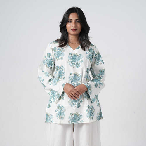 Aqua blue floral short kurti for women with blue rose prints on a white base