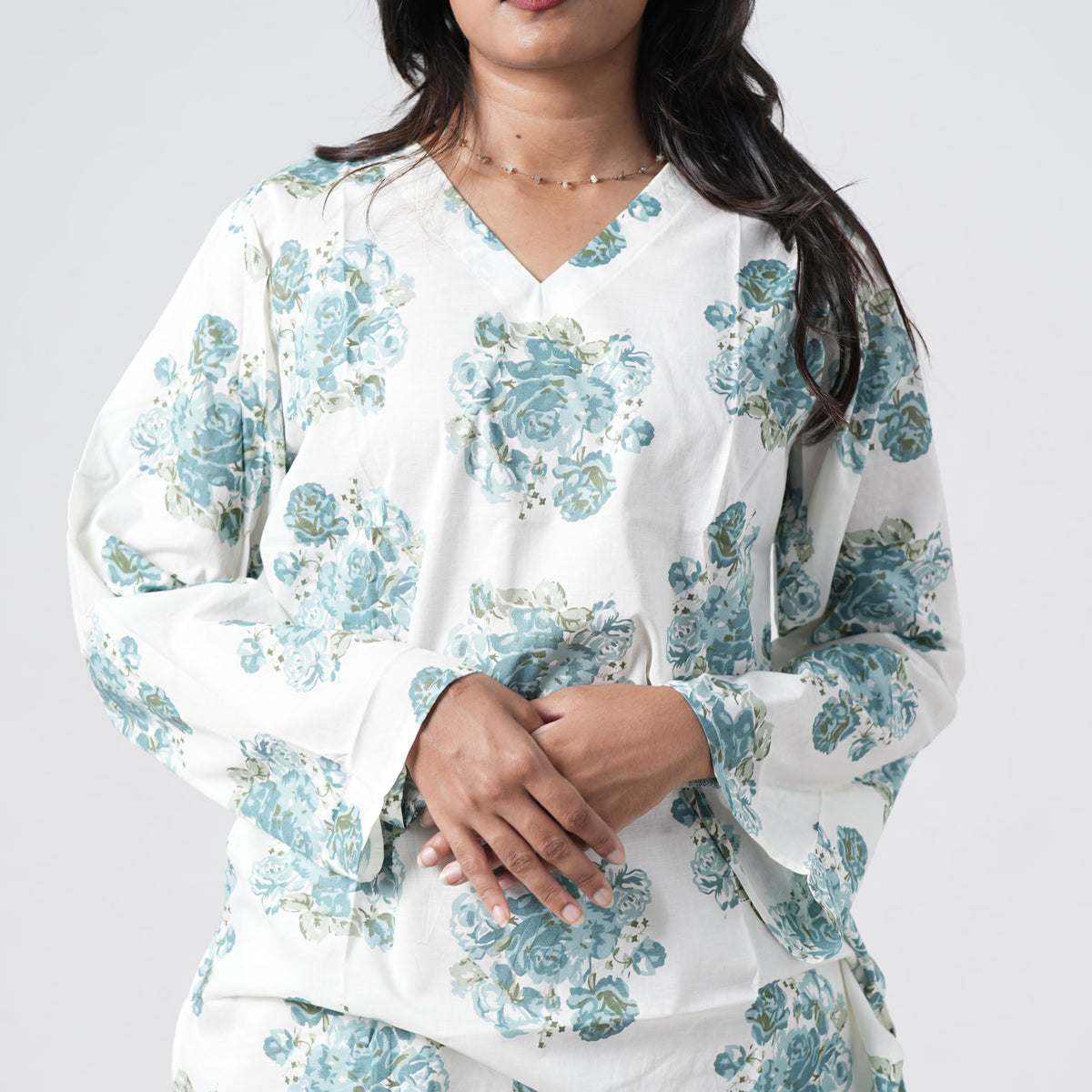 Aqua blue short kurti with wide sleeves and blue floral prints
