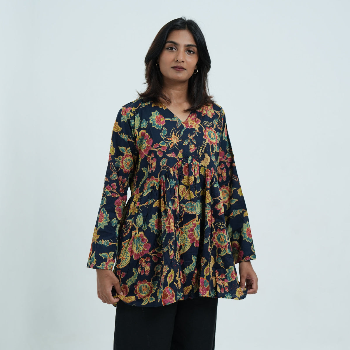 Arohi Garden Flared Kurti for women featuring a navy blue base, colourful floral print, V neckline and flared silhouette