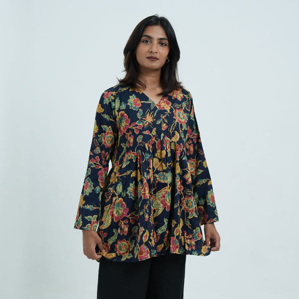 Arohi Garden Flared Kurti for women featuring a navy blue base, colourful floral print, V neckline and flared silhouette