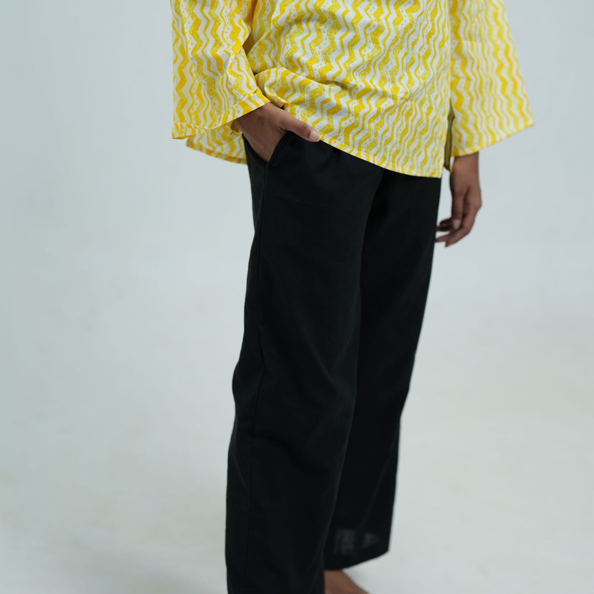Black women's wide leg pants featuring functional side pockets and a comfortable design