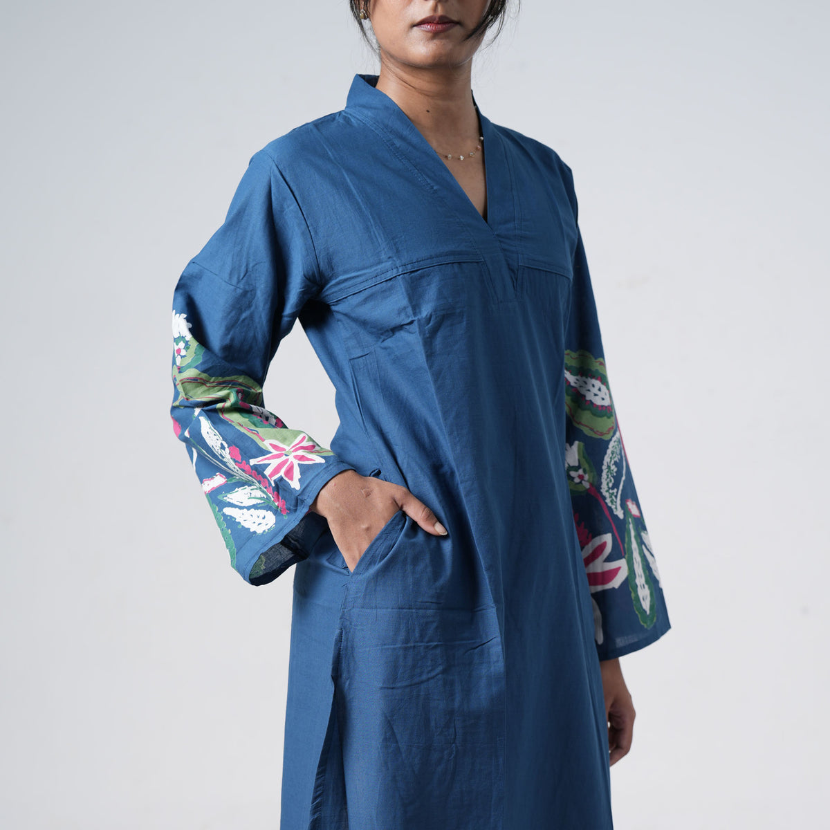 Boho Neel Long Kurti in blue featuring colourful floral border prints and a relaxed long silhouette