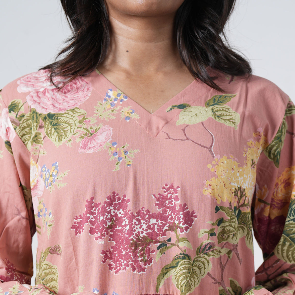Inaya Long Kurti with a V neckline and multicolour floral print on a dusty pink base
