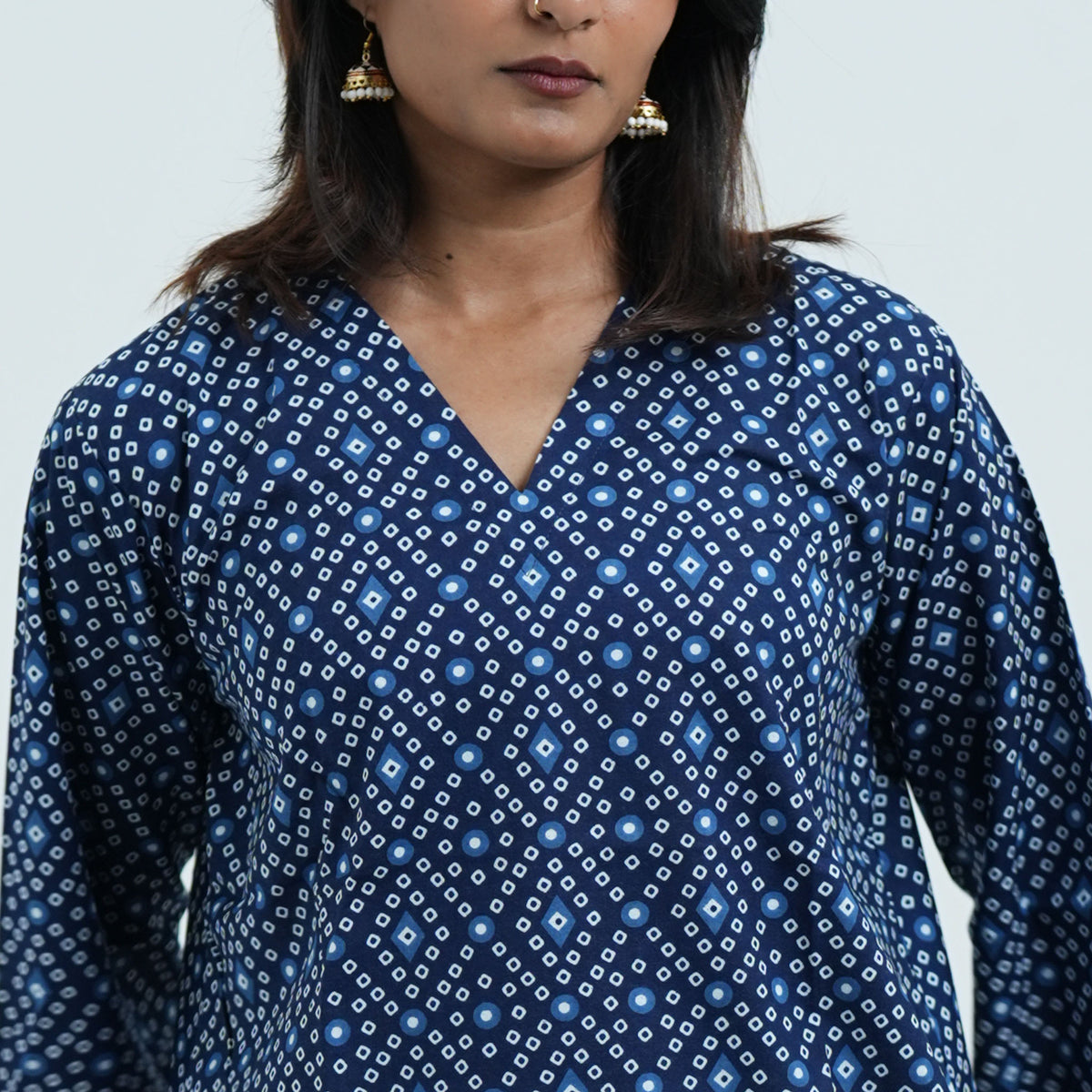Indigo Muse Short Kurti with a V neckline and intricate white and light blue geometric patterns on navy blue fabric