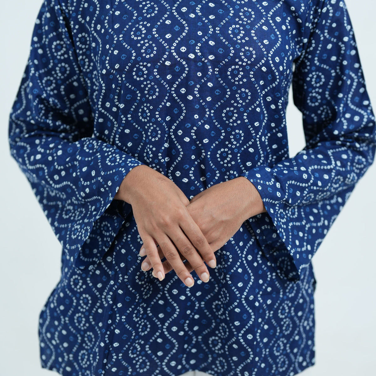 Indigo Wave Short Kurti featuring long, wide sleeves with white Bandhani-style prints on navy blue fabric