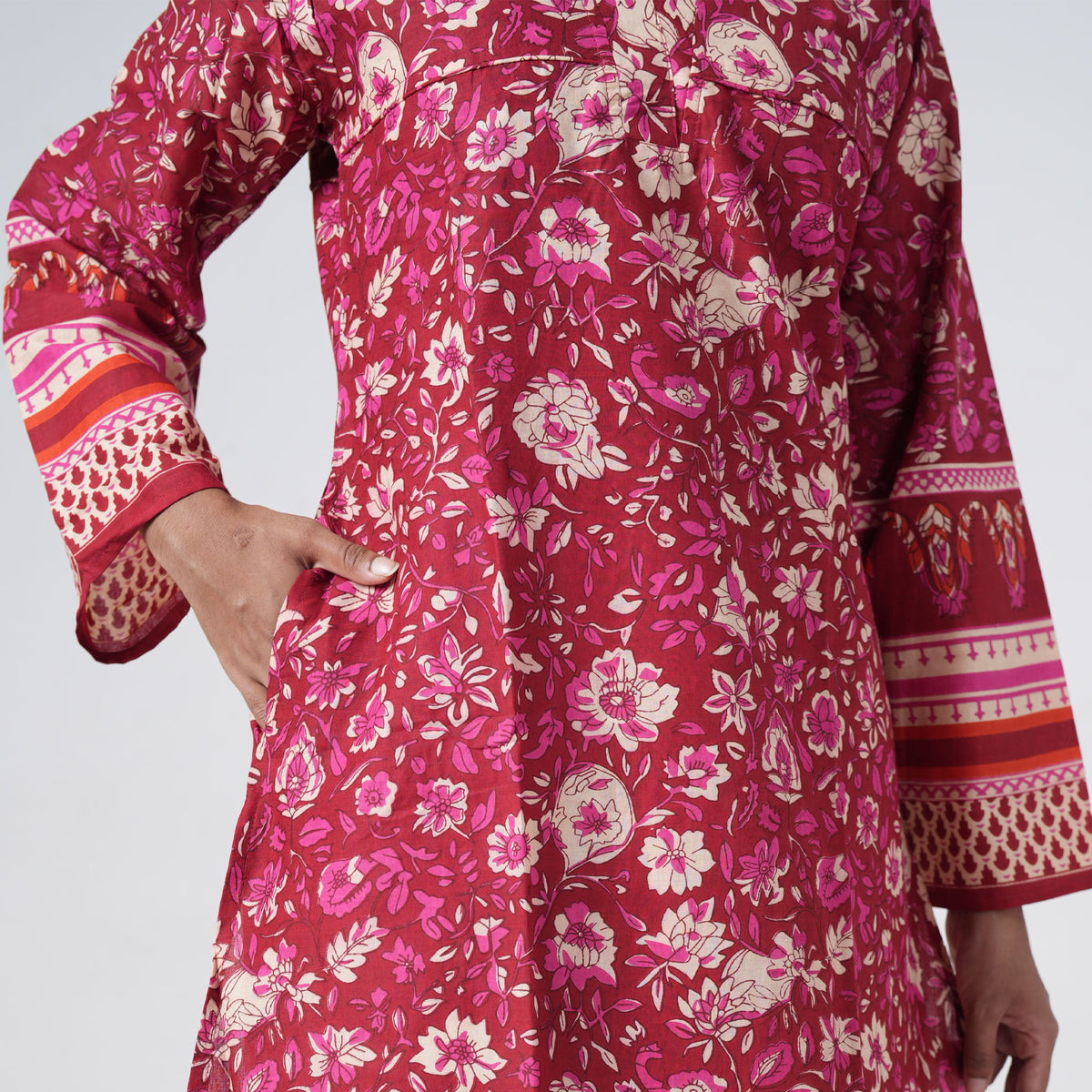 Laal Rang Long Kurti in deep red with floral prints and decorative patterned borders
