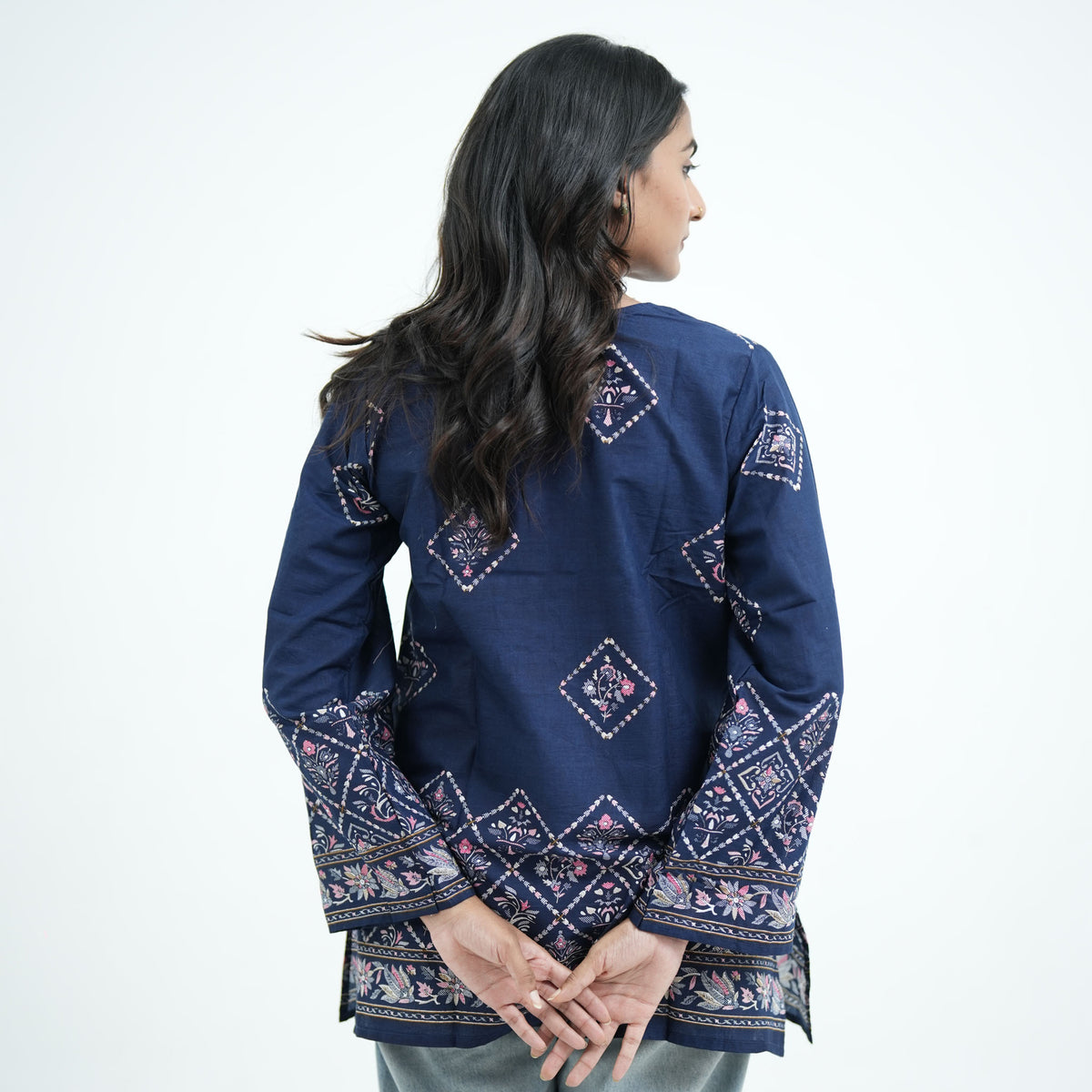 Back view of Luna Short Kurti featuring navy blue fabric, geometric floral prints and decorative border patterns