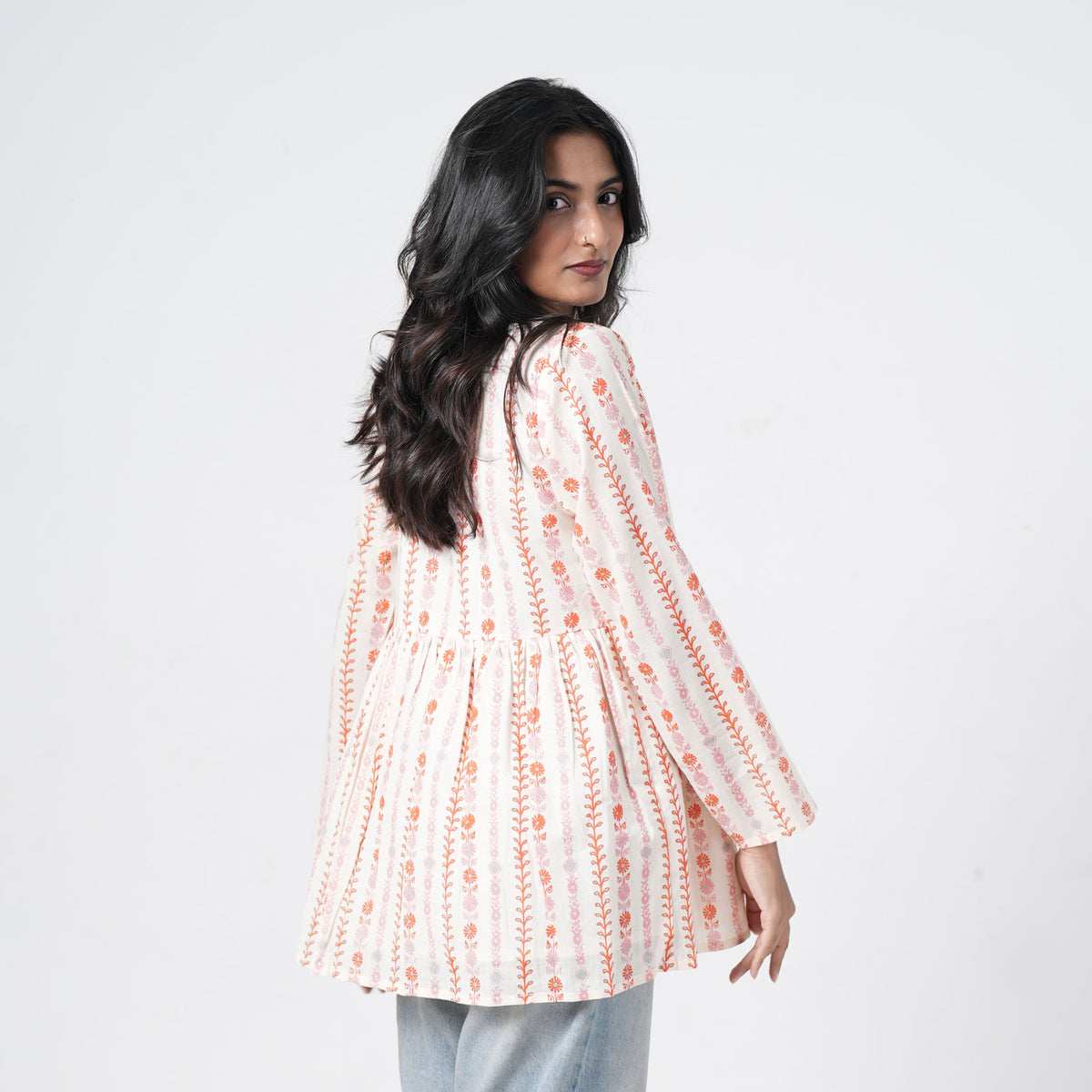 Back view of Mogra white flared kurti with orange and pink floral prints