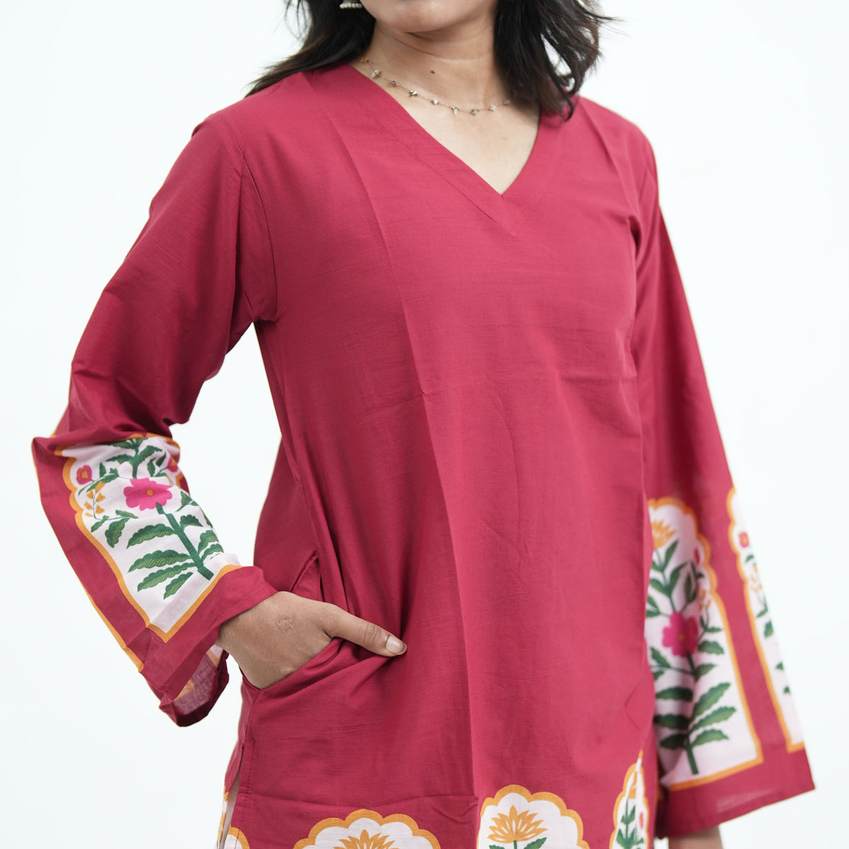 Mughal Knee Kurti in maroon with colourful floral border prints and a knee-length silhouette