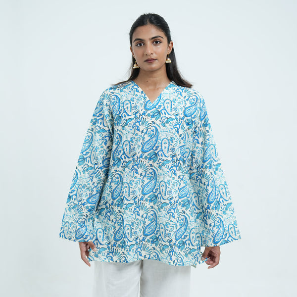 Neelam Noor Short Kurti for women featuring a white base, blue paisley print, V neckline and a relaxed fit