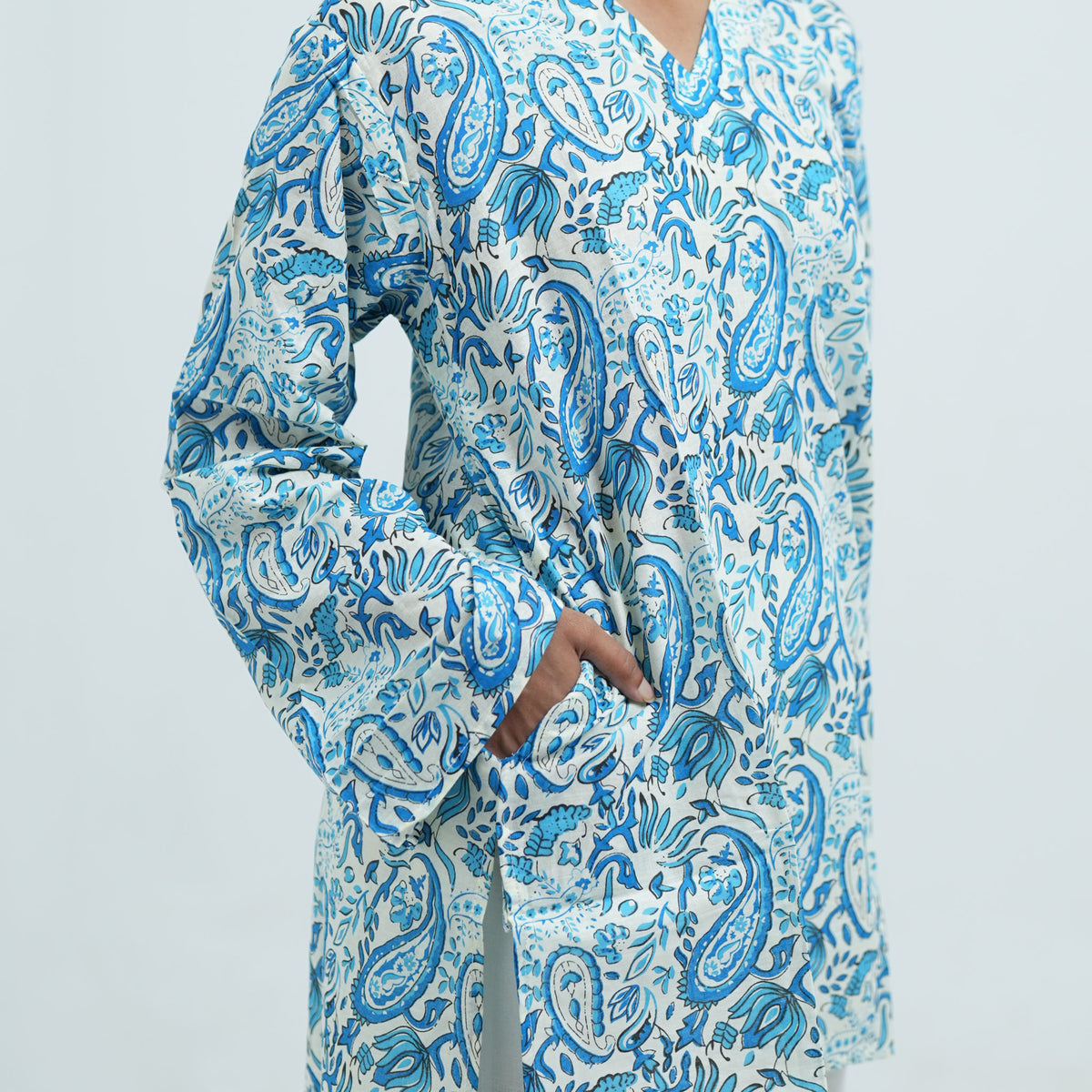 Neelam Noor Short Kurti in white with blue paisley print and a relaxed straight silhouette