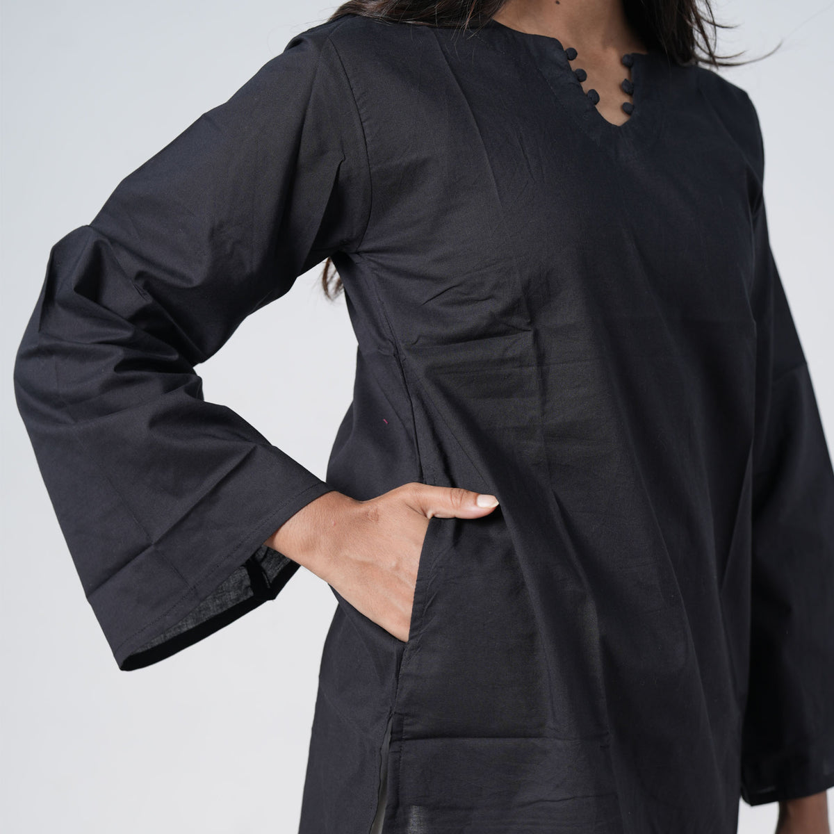 Nisha Short Kurti in black featuring a simple design and relaxed silhouette