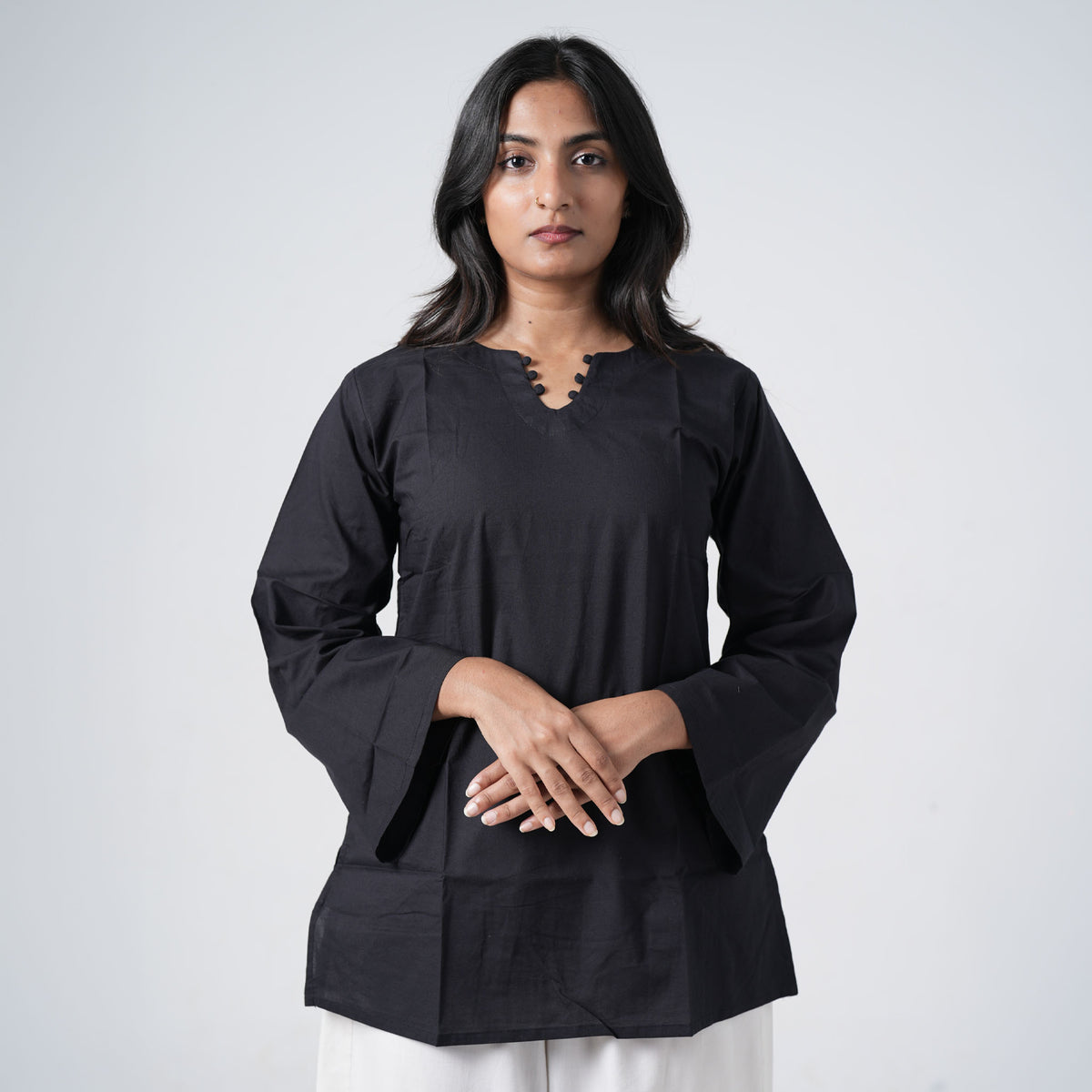 Nisha Short Kurti with a V-shaped neckline decorated with small black button details