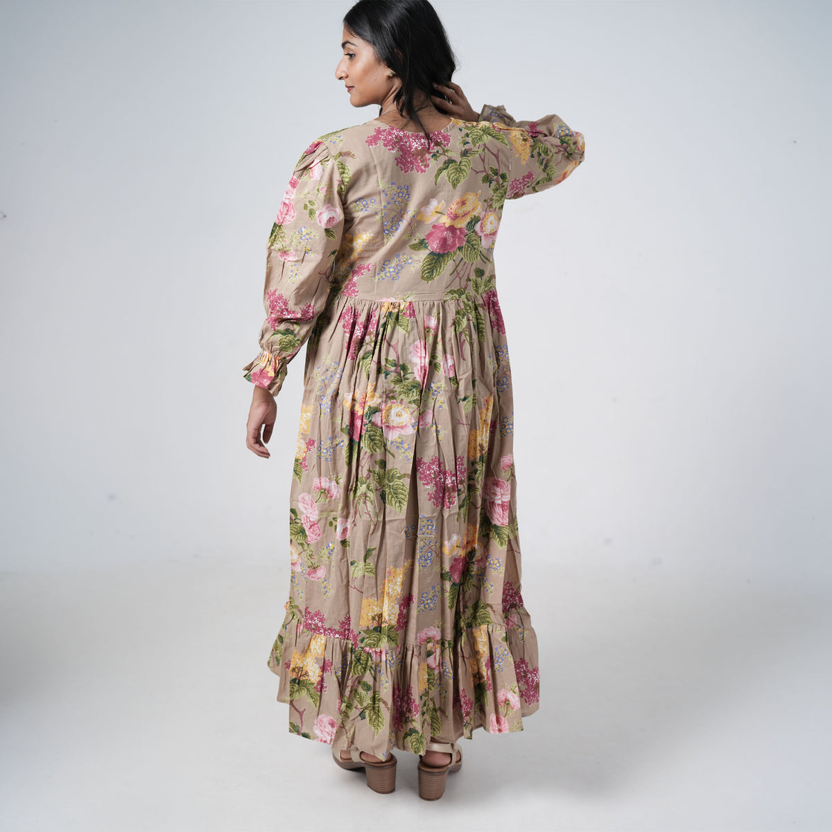 Back view of Olive Bloom Long Kurti featuring colourful floral prints, long sleeves and a tiered flared hem
