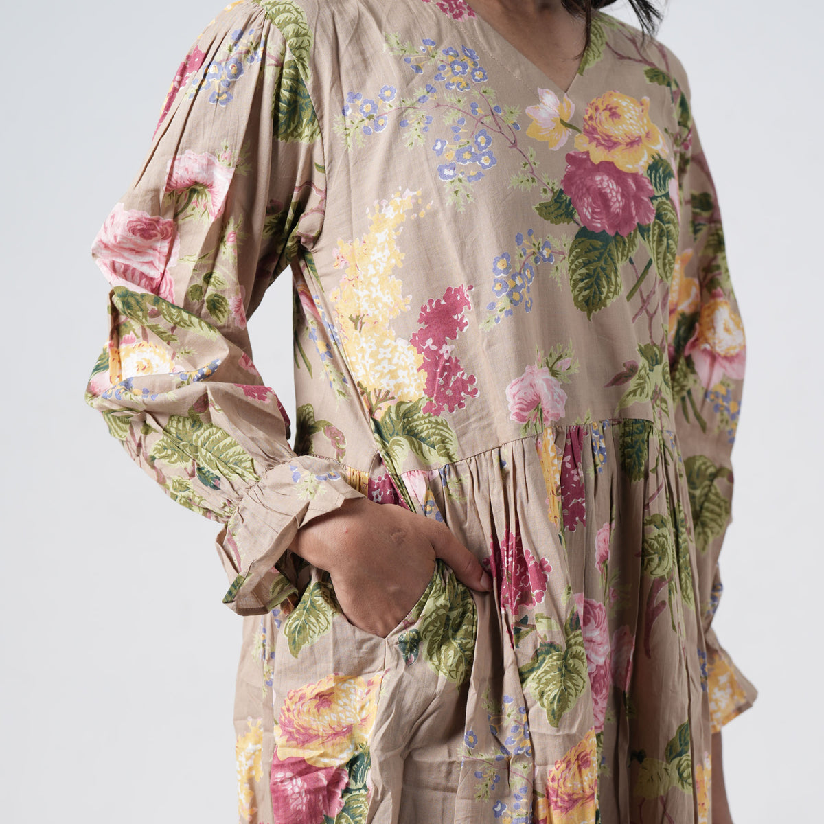 Olive Bloom Long Kurti in beige with colourful floral prints and a tiered design