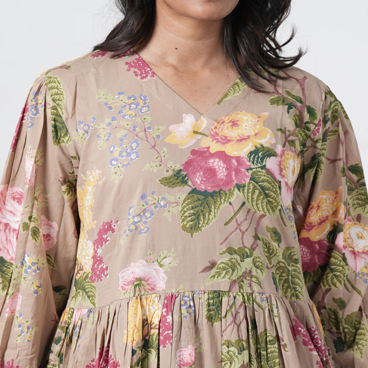 Olive Bloom Long Kurti with a V neckline and colourful floral print on beige fabric