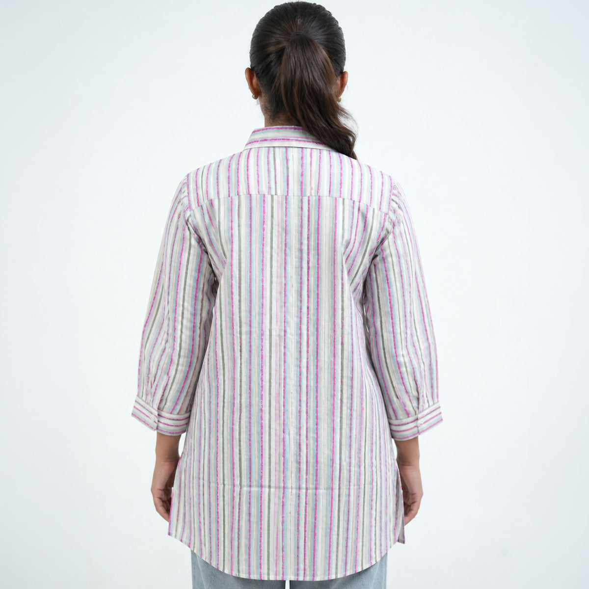 Back view of Pastels Shirt featuring vertical pink, blue and grey stripes with a relaxed fit
