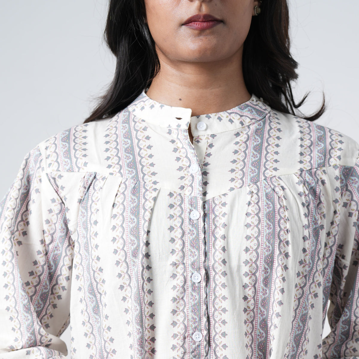Pearl Long Kurti featuring a round neckline with a short button placket and vertical geometric prints