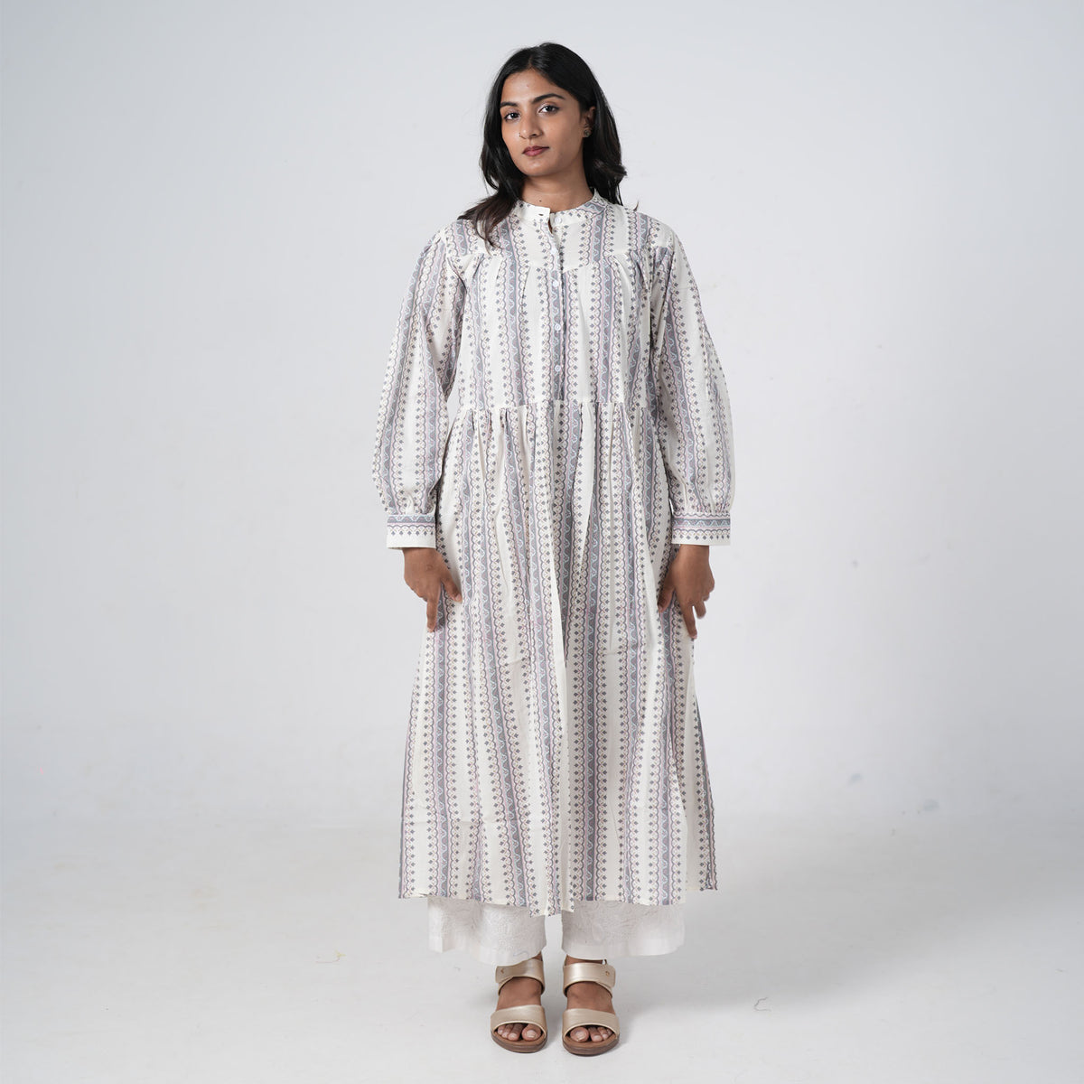Pearl Long Kurti for women featuring an ivory base with grey and mauve vertical geometric prints, a buttoned neckline and a flared silhouette