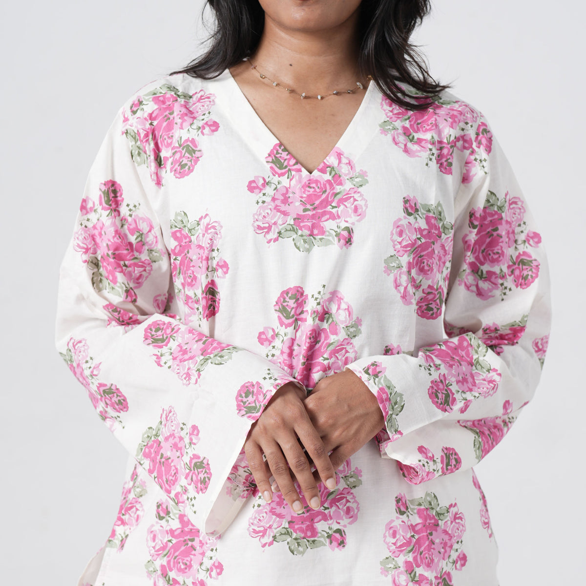 Pink floral short kurti with wide sleeves and pink rose prints