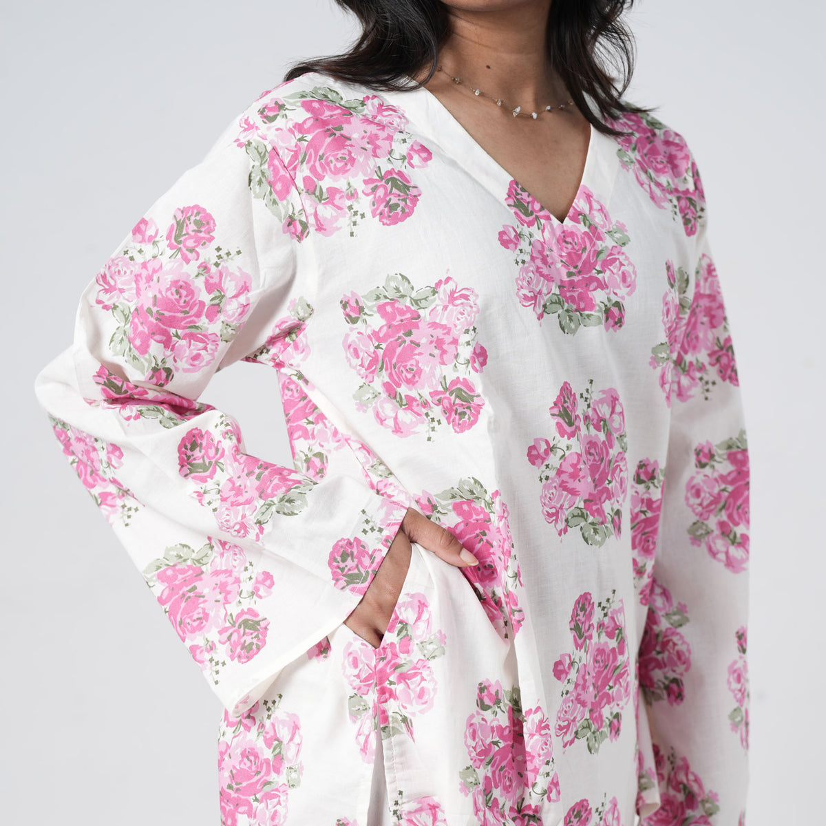 Pink floral short kurti for women with side pockets and rose prints