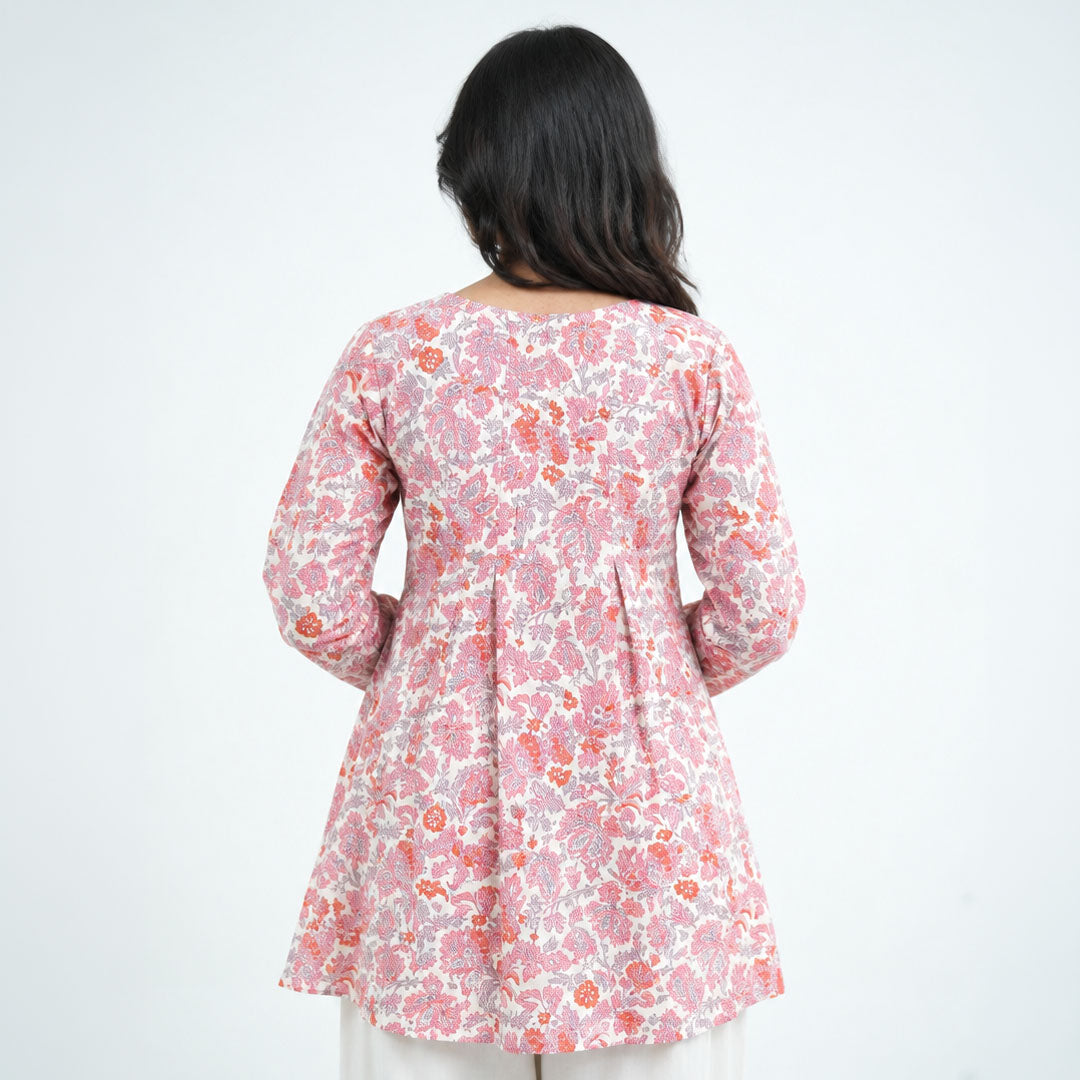 Back view of Rosette Umbrella Kurti with pink, coral and grey floral prints on an ivory base