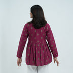 Back view of Rubi Flared Kurti in wine colour with small traditional motifs and a flared silhouette