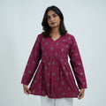 Rubi Flared Kurti for women in a rich wine colour with small traditional motifs, a V neckline and a gathered flared design