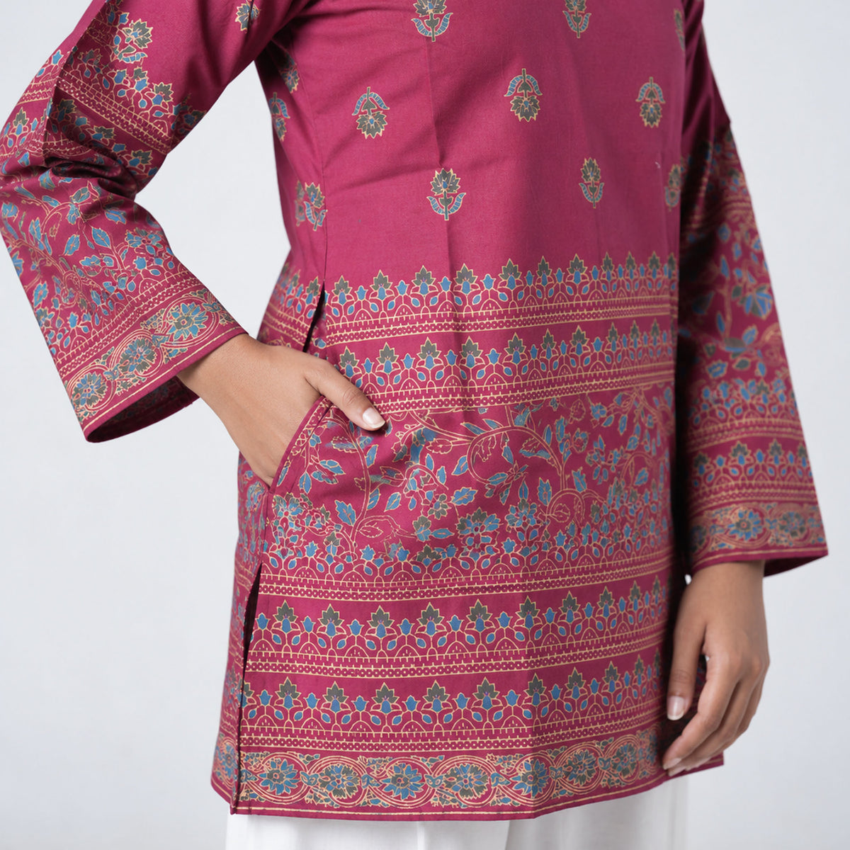 Ruby Short Kurti in ruby pink with floral motifs and decorative multicolour border patterns