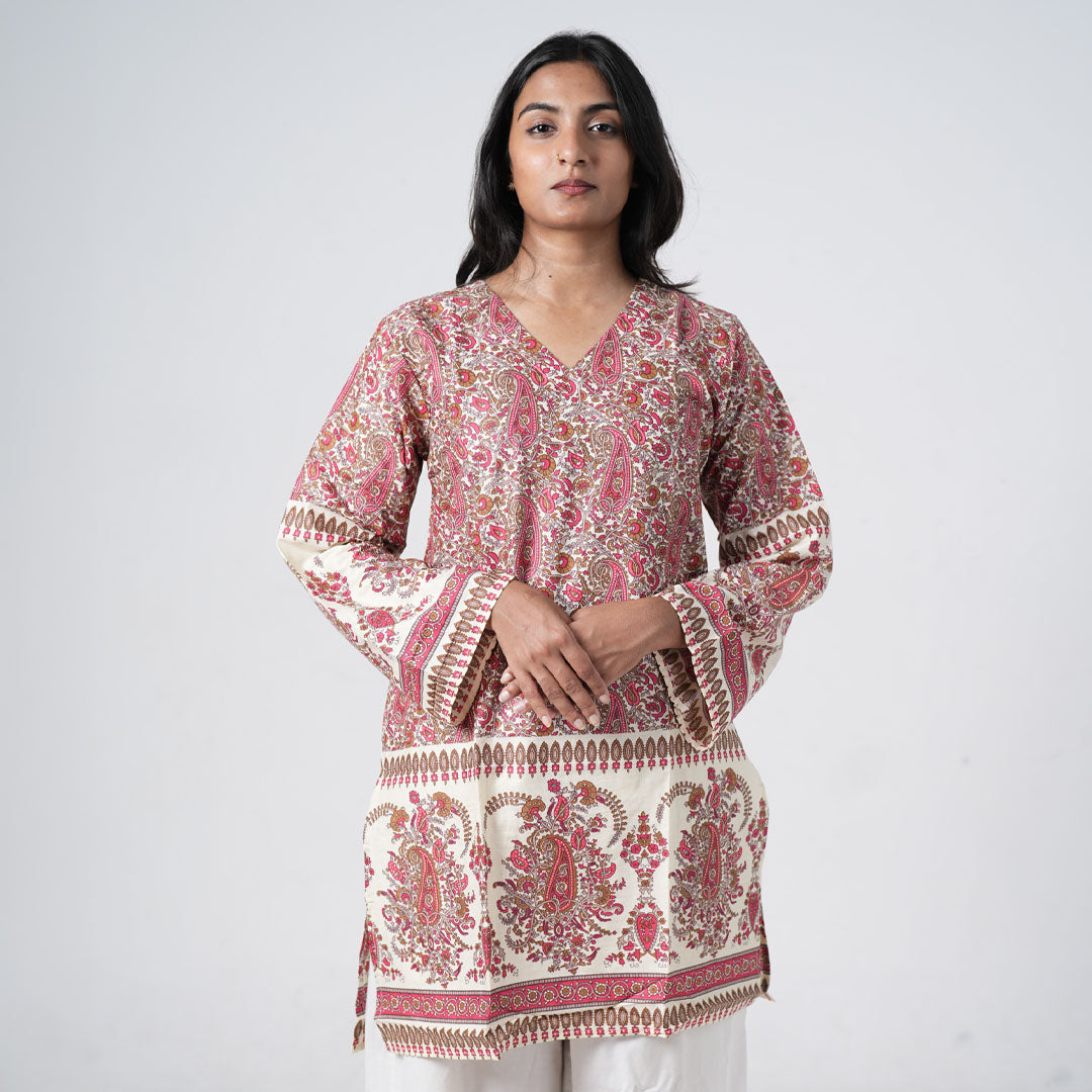 Ruhaani knee length kurti with pink and brown paisley prints on a cream background