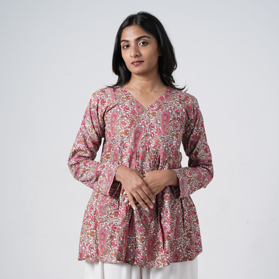 Ruhaani printed flared kurti for women with pink and brown paisley patterns on a cream base