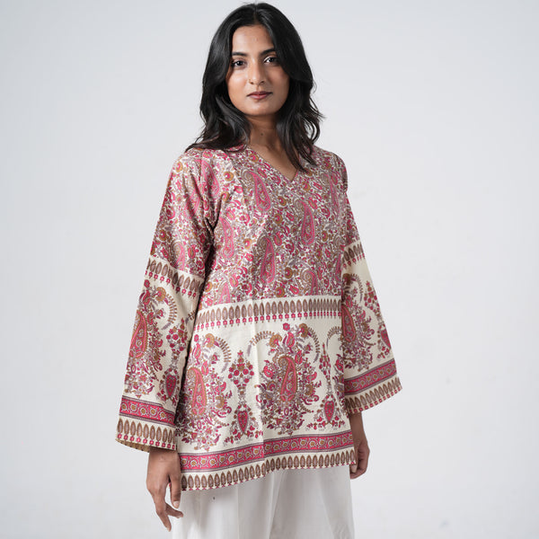 Ruhani Short Kurti for women in cream with red and brown paisley prints, a V neckline and decorative border patterns