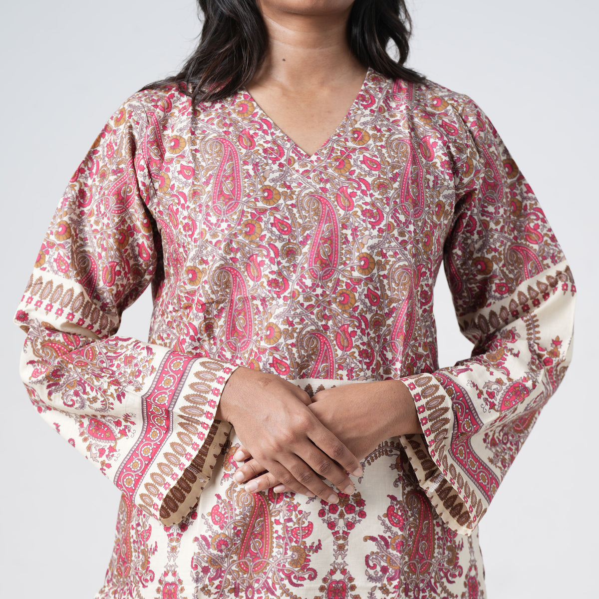 Ruhani Short Kurti featuring wide three-quarter style sleeves with red and brown paisley prints and patterned borders