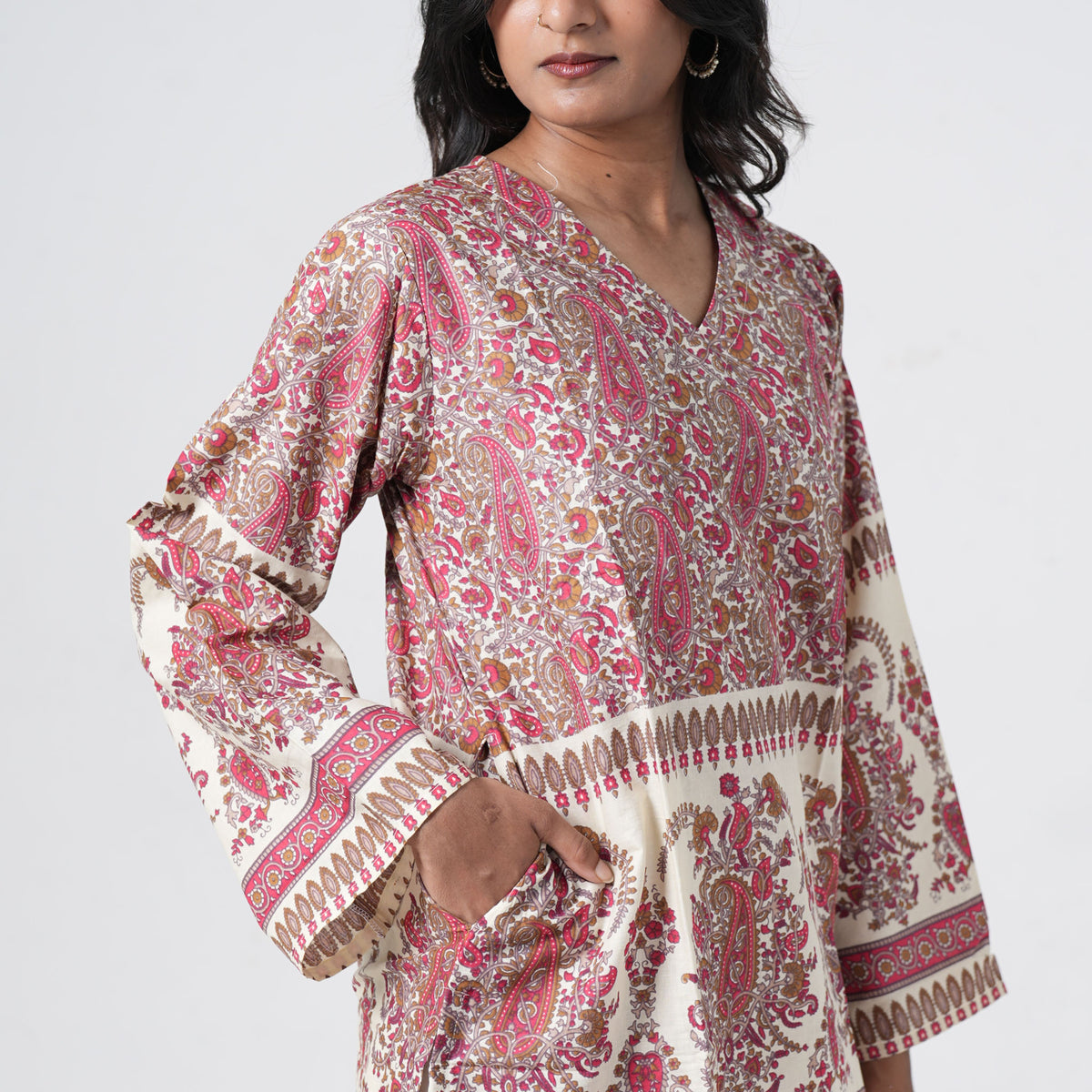 Ruhani Short Kurti in cream with red and brown paisley prints and decorative hem borders