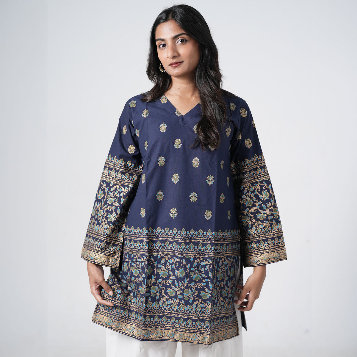 Sapphire blue knee length kurti for women with floral motifs and decorative printed borders