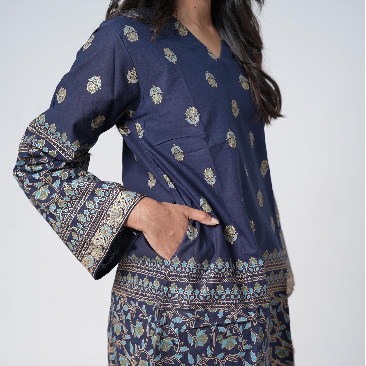 Sapphire blue knee length kurti for women with a side pocket and printed borders