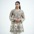 Sukoon knee length printed kurti for women with green and brown paisley patterns on a cream base