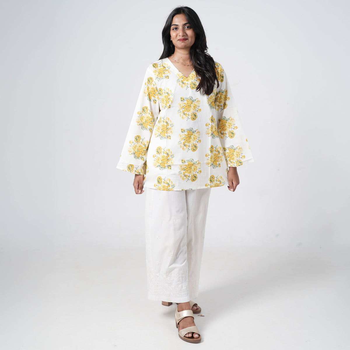 Yellow floral short kurti with wide sleeves and yellow rose prints