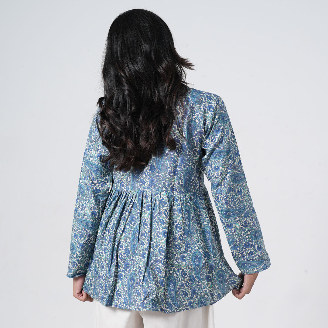 Back view of Zareen Flared Kurti featuring blue paisley prints, long sleeves and a gathered flared design