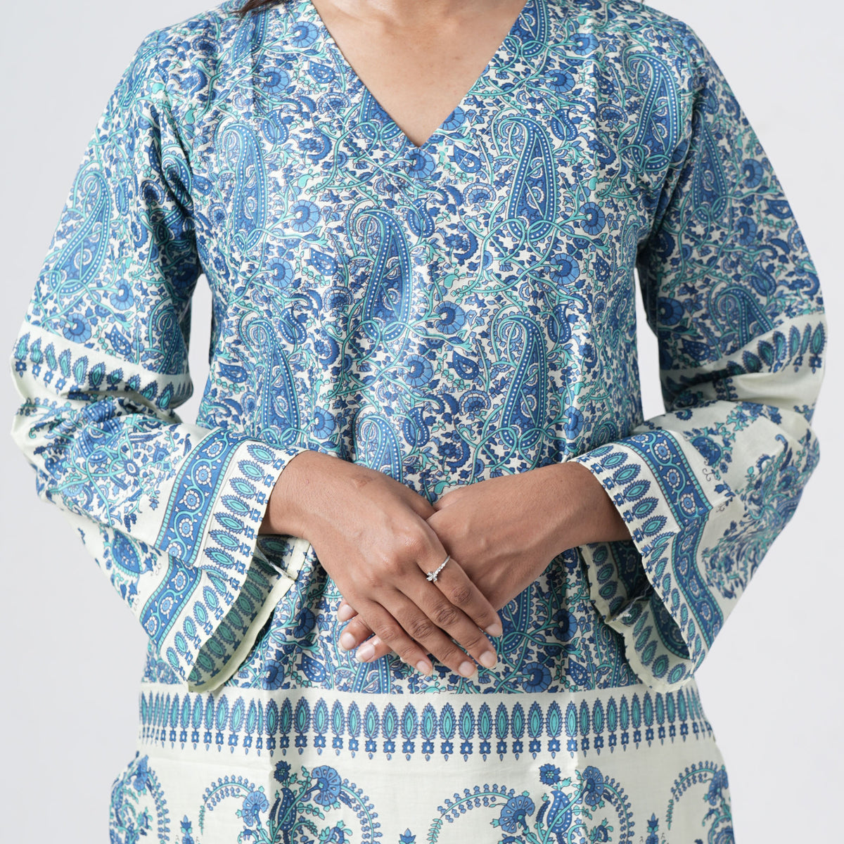 Zareen Knee Kurti featuring long flared sleeves with blue paisley prints and decorative patterned cuffs